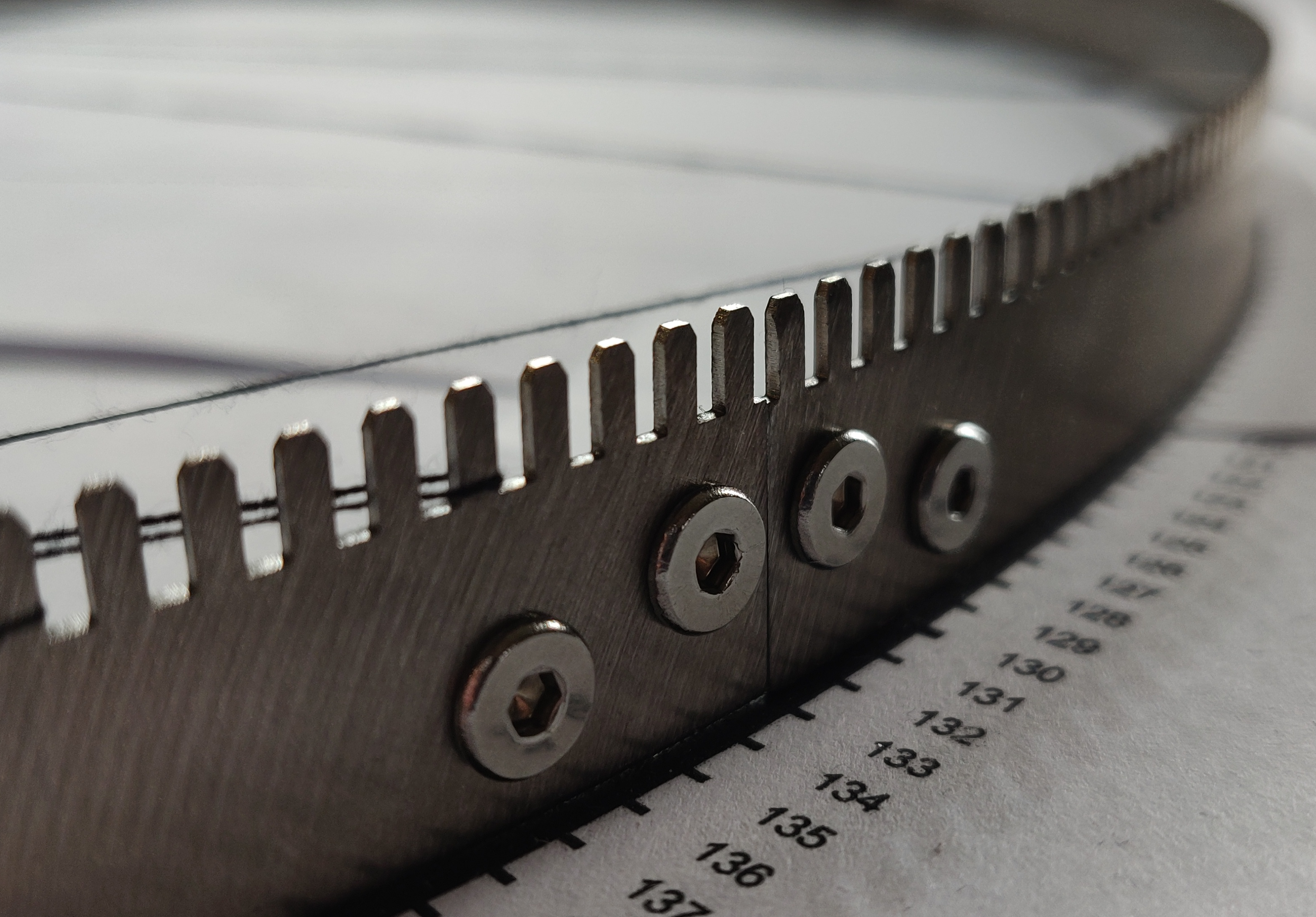 Close-up of the stainless steel frame and its machined nail teeth
